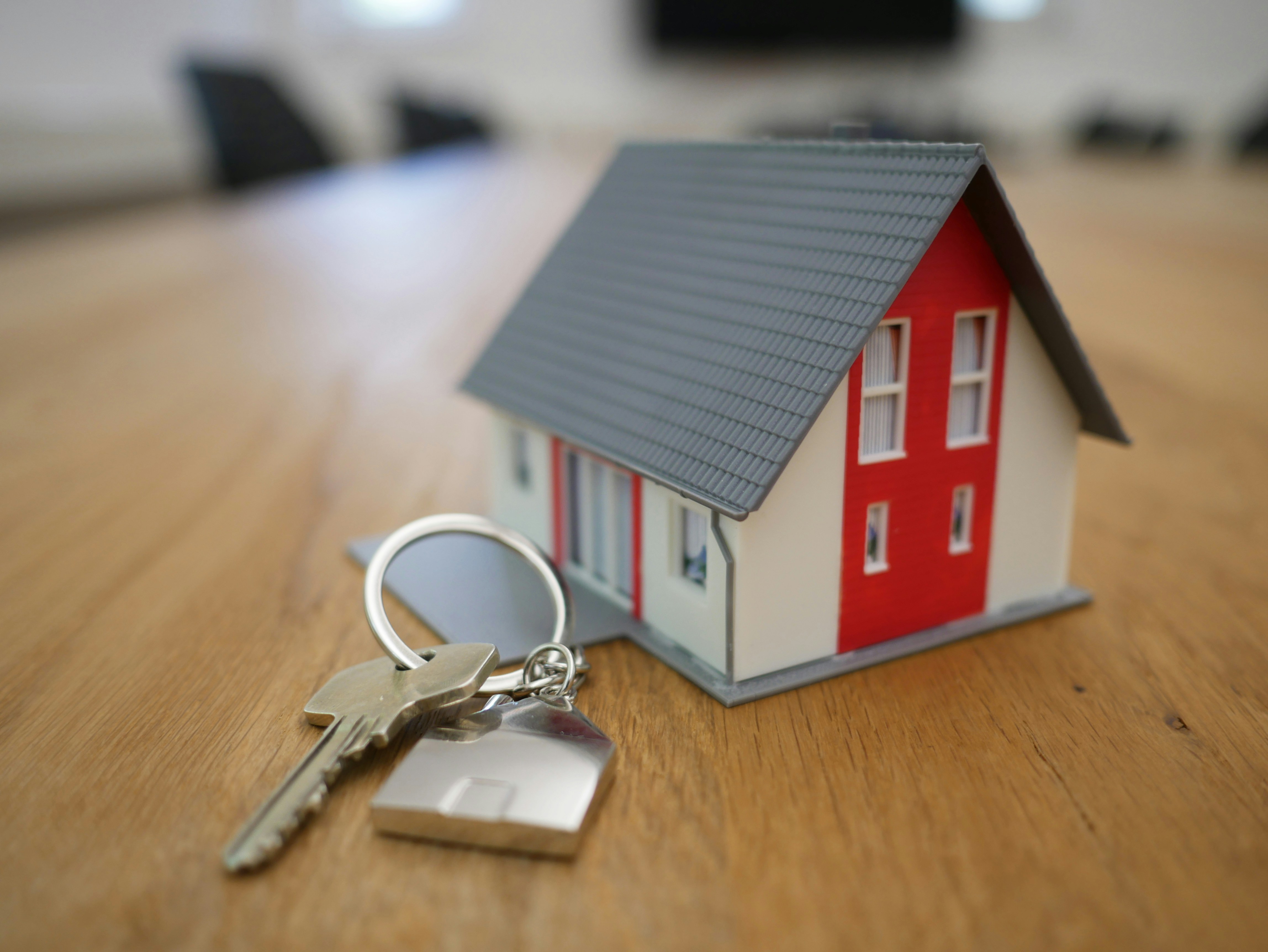 Image of a house and keys depicting a property purchase